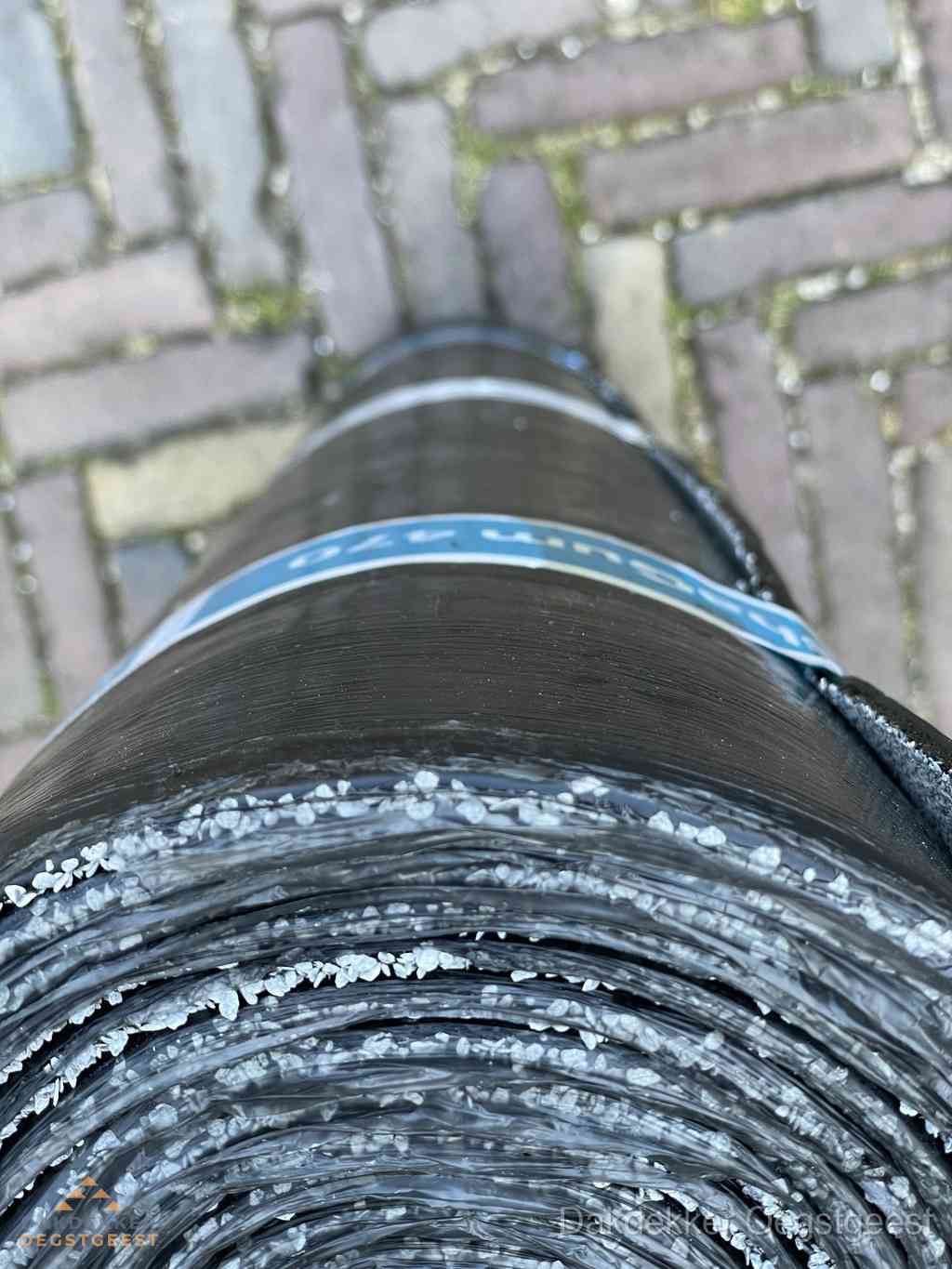Rol bitumen dakleer met leislag voor plat dak in Oegstgeest Rol bitumen dakleer met leislag voor plat dak in Oegstgeest